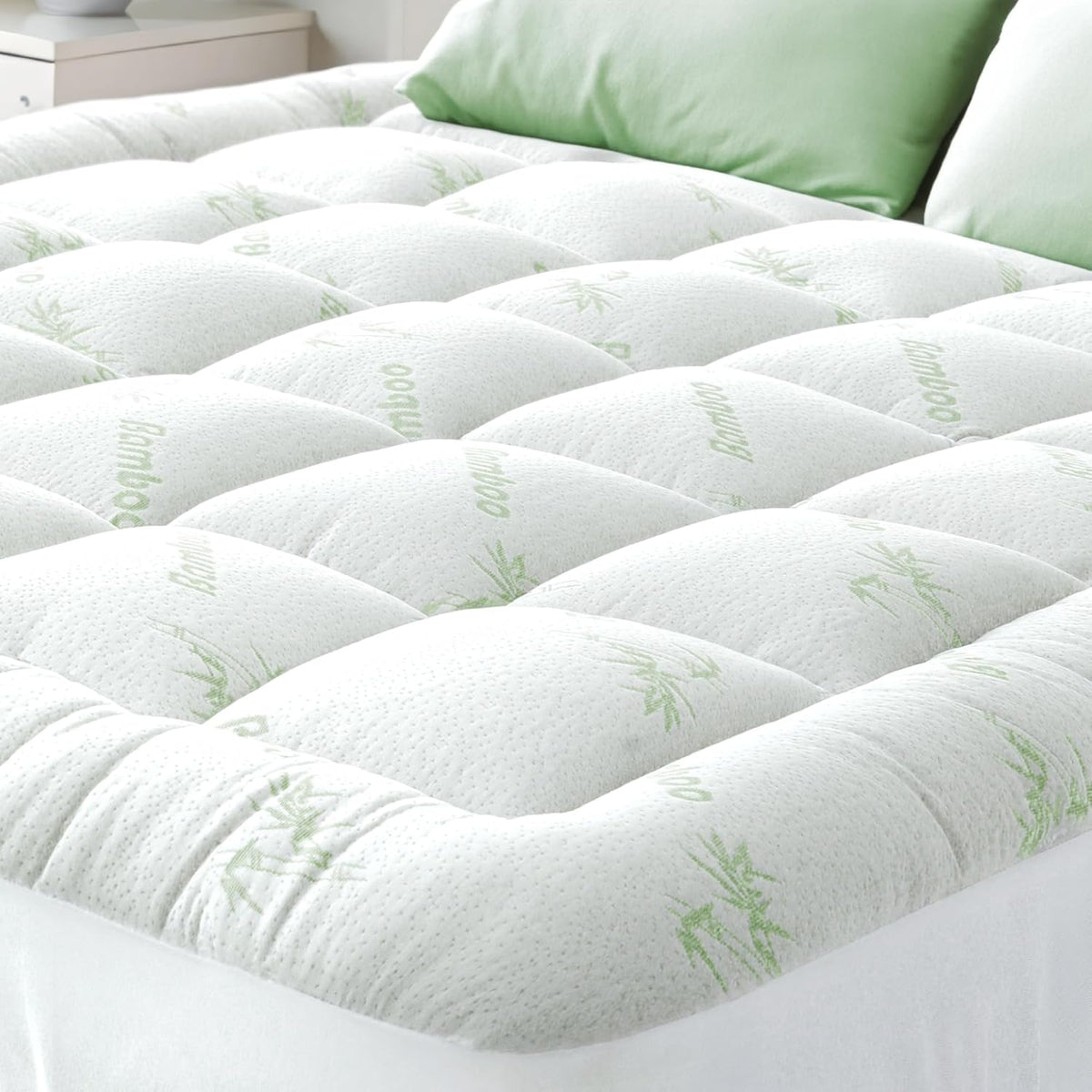 Close-up of the plush quilted squares and bamboo-leaf print